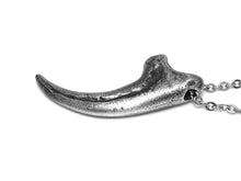 Antiqued Velociraptor claw pendant in lead-free pewter, shown from above
